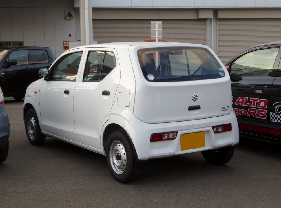 Compact hatchback rear and side view with boxy design and steel wheels