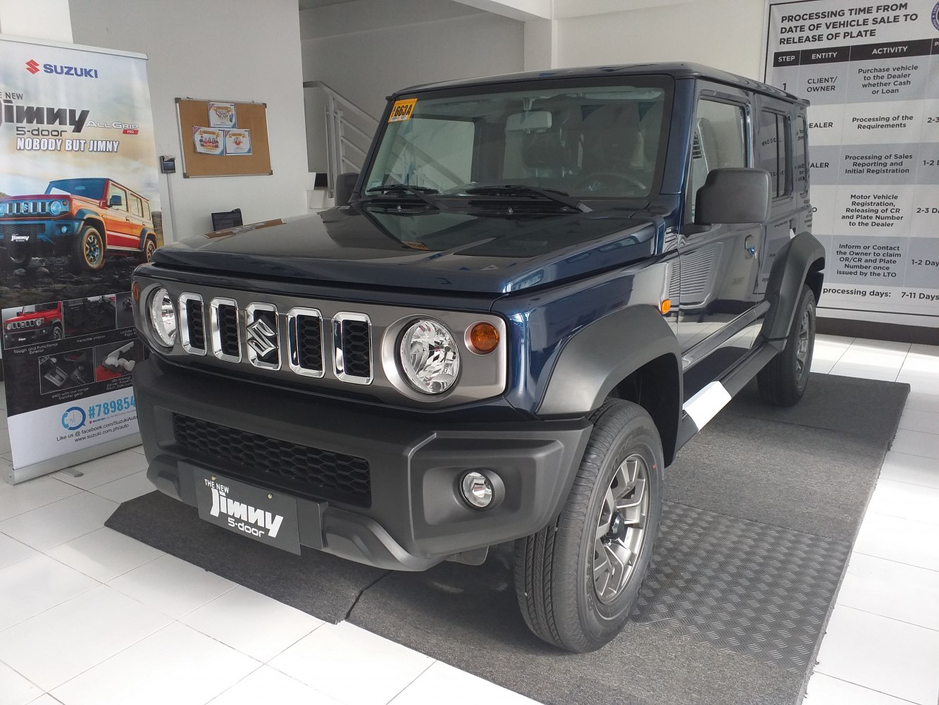 Front view of compact SUV with round headlights and robust grille design