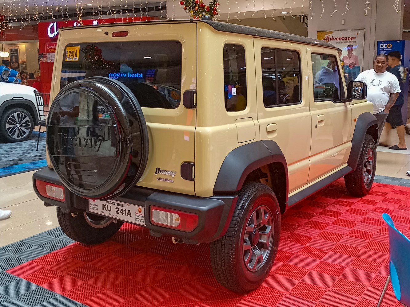Rear and side view of 5-door compact SUV with spare tire on back