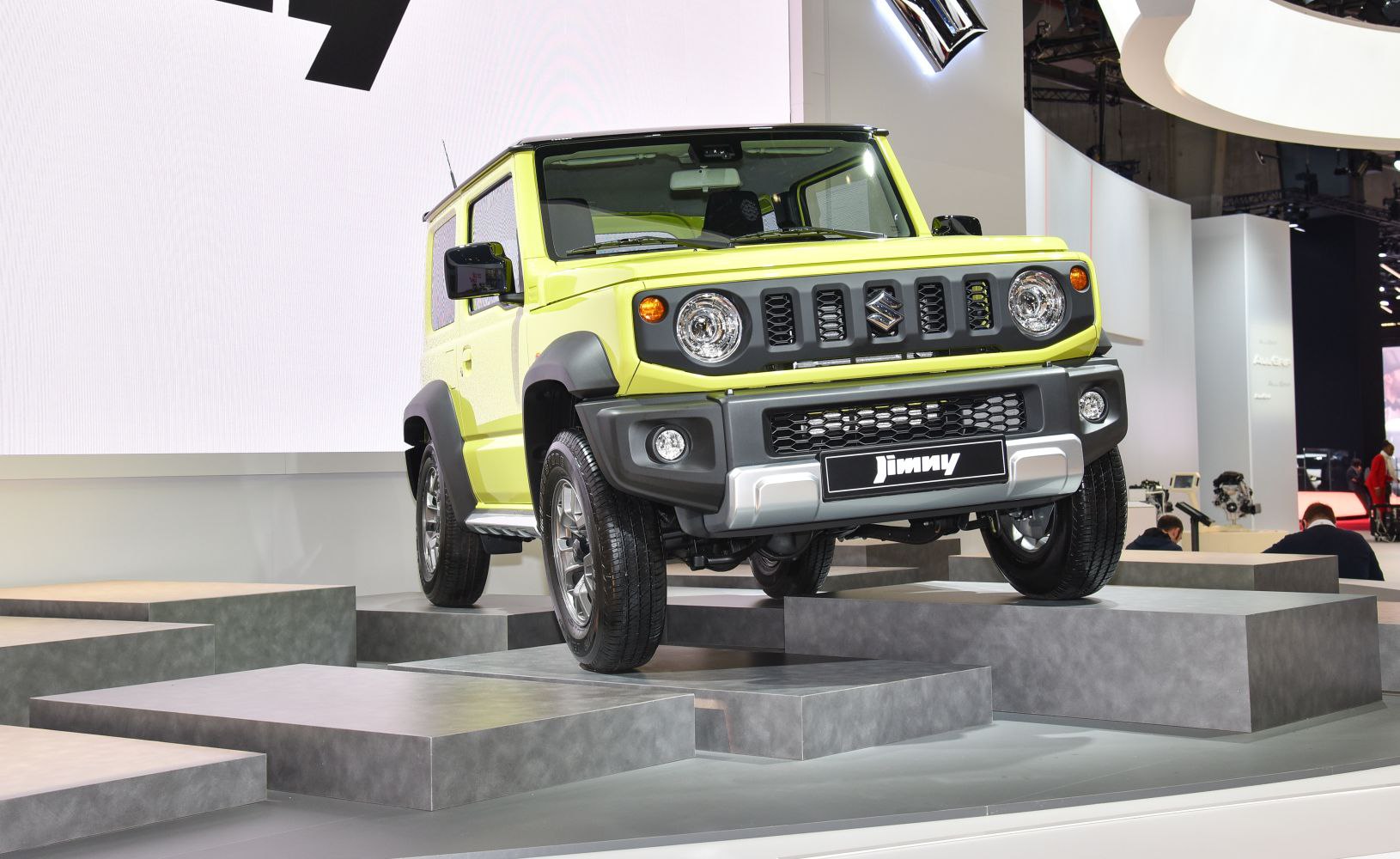 Front view of rugged 3-door off-road compact SUV with round headlights