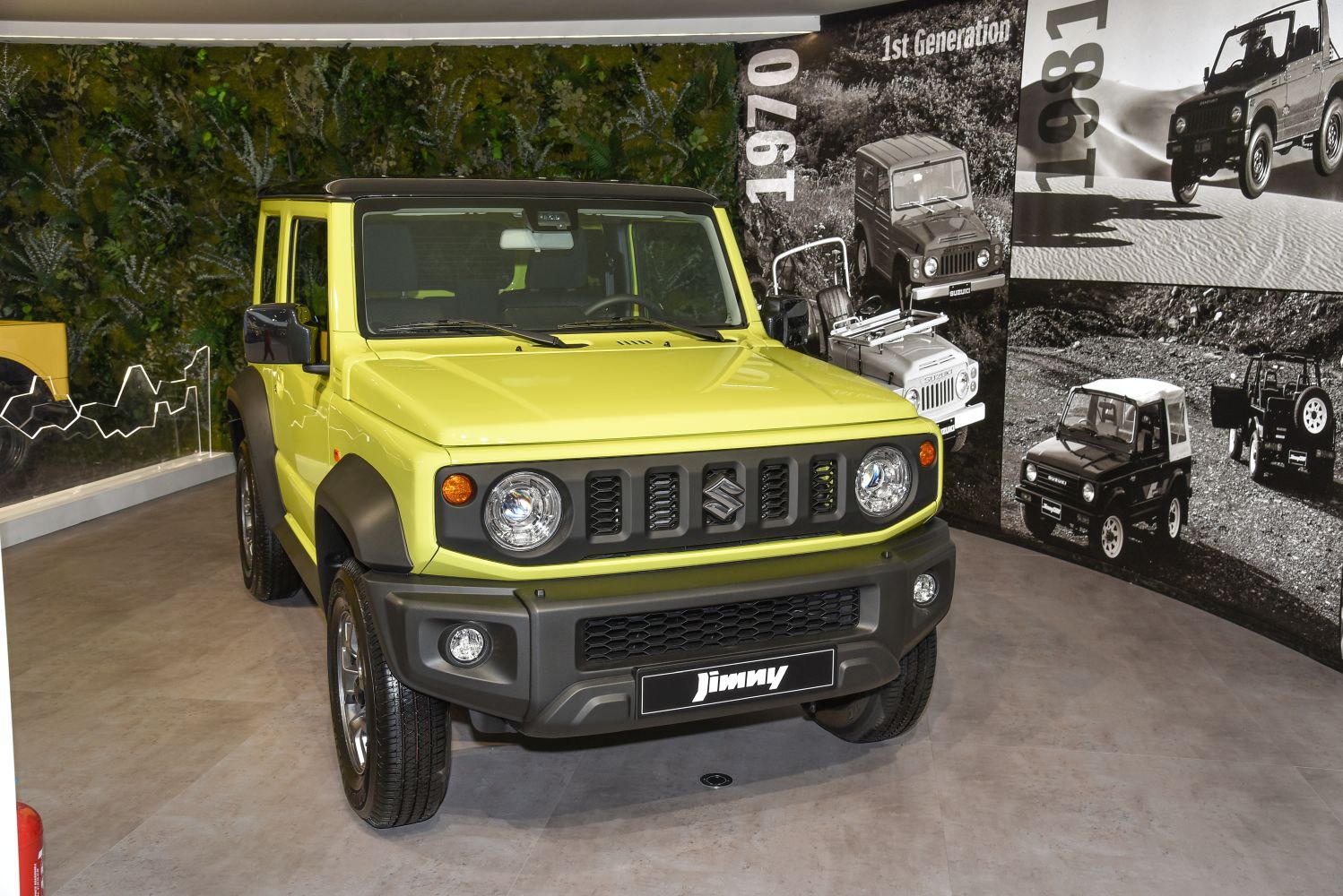 Front view of compact 3-door SUV with round headlights and rugged grille.