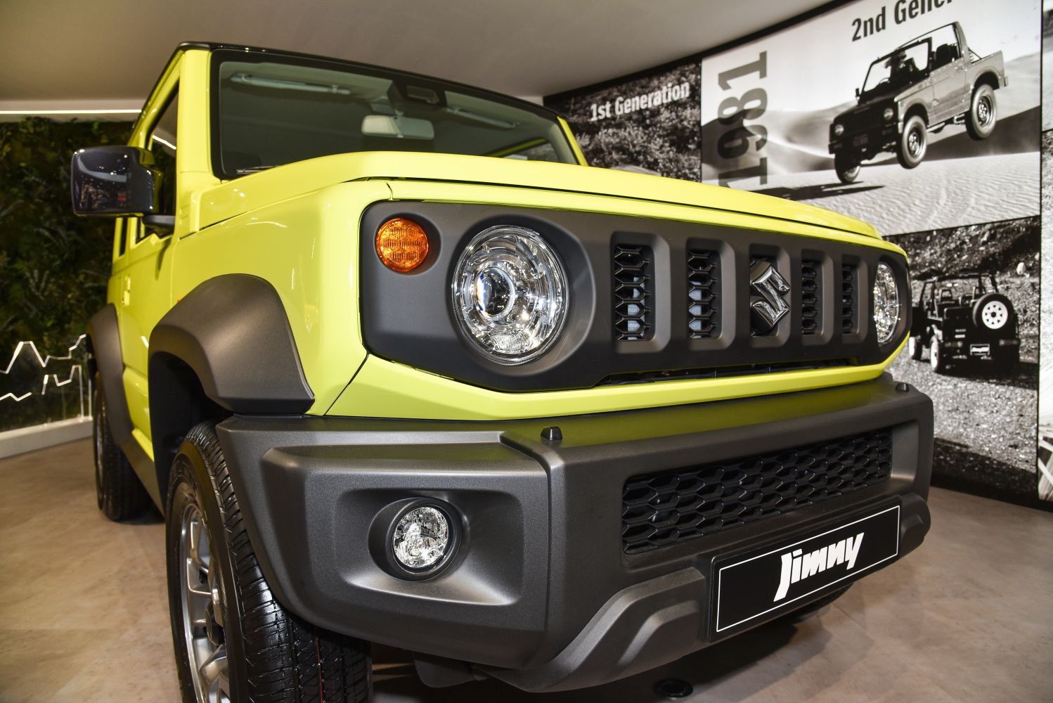Close-up of rugged SUV front with round headlights and vertical-slat grille