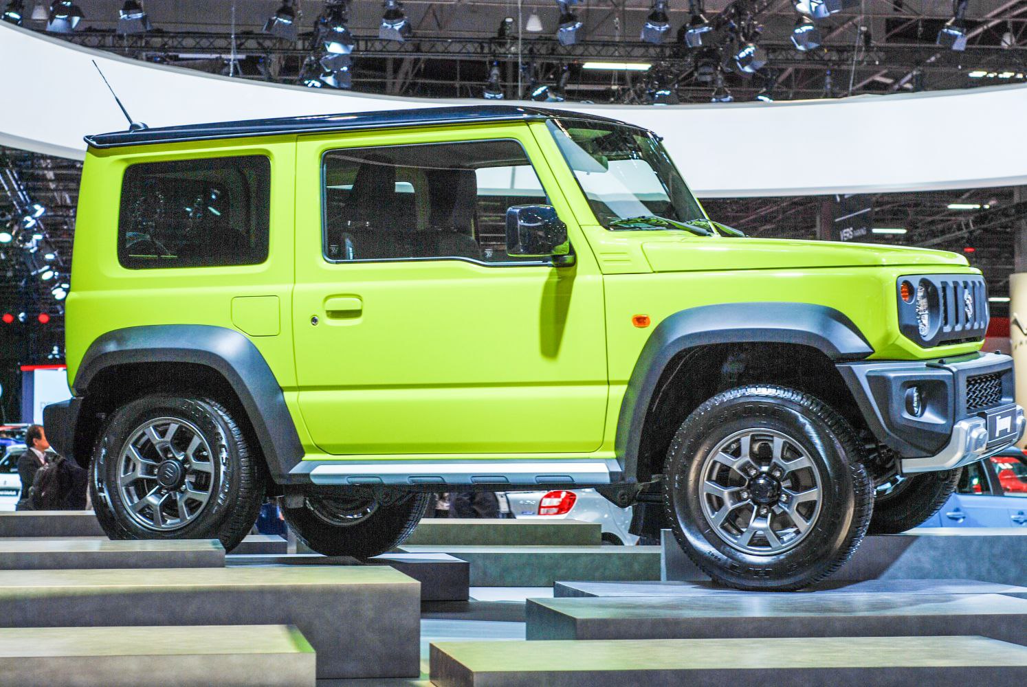 Compact 3-door off-road SUV with boxy design in bright green.