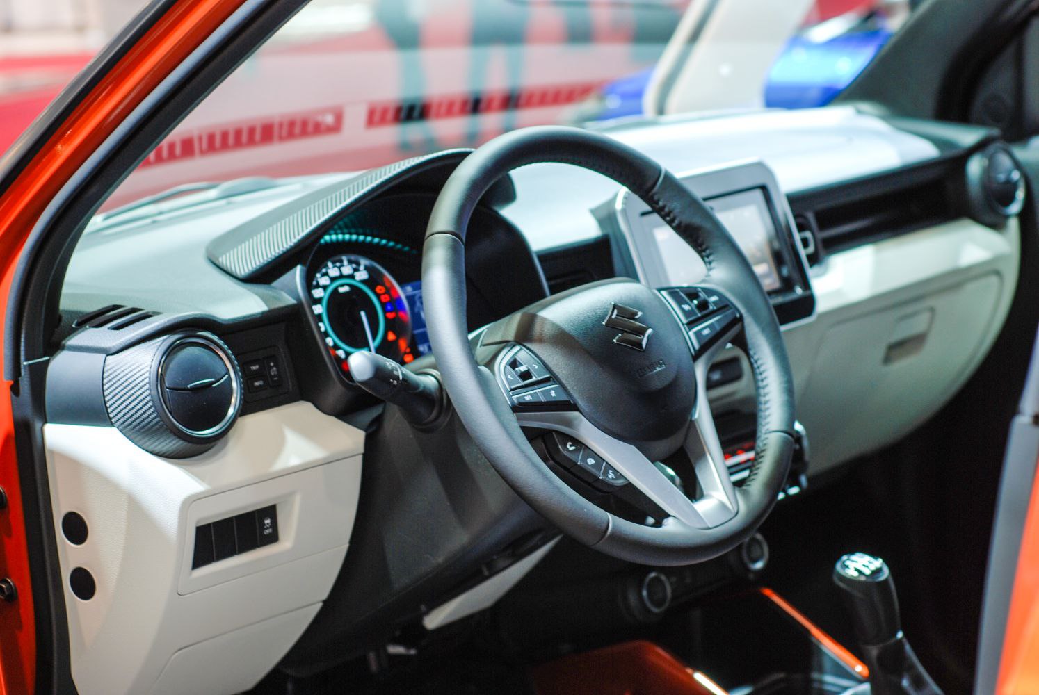 Steering wheel, dashboard, and instrument cluster interior details.