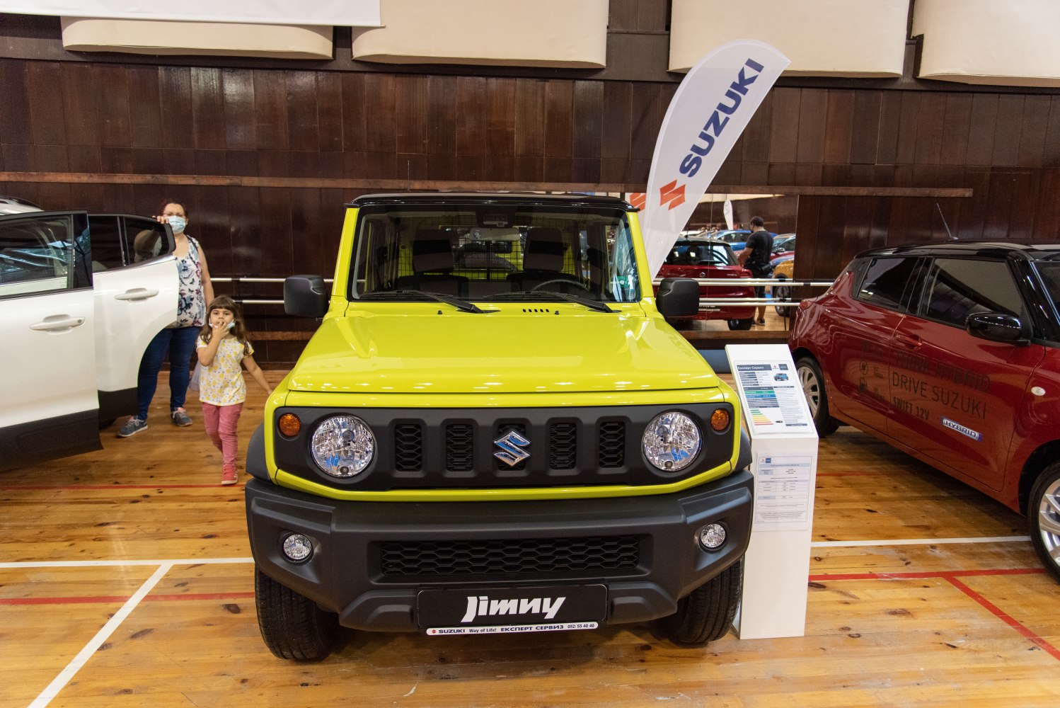 Front view of yellow compact SUV with round headlights and rugged grille