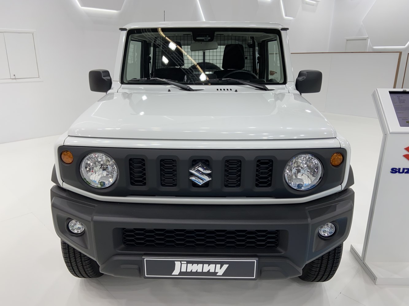 Front view with round headlights and bold grille