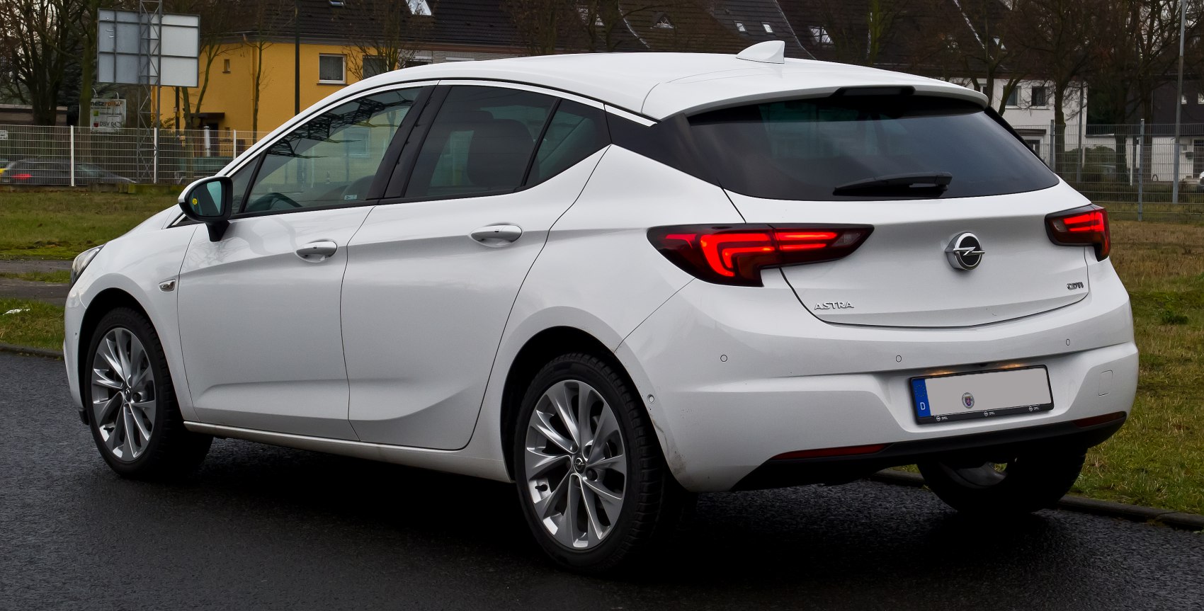 Rear side view with LED taillights and hatchback design