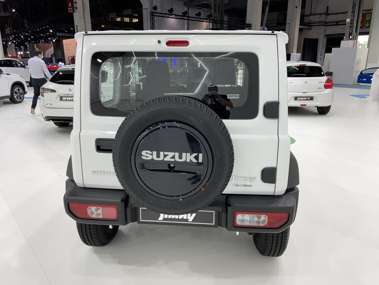 Rear view with tailgate-mounted spare tire and rectangular tail lights