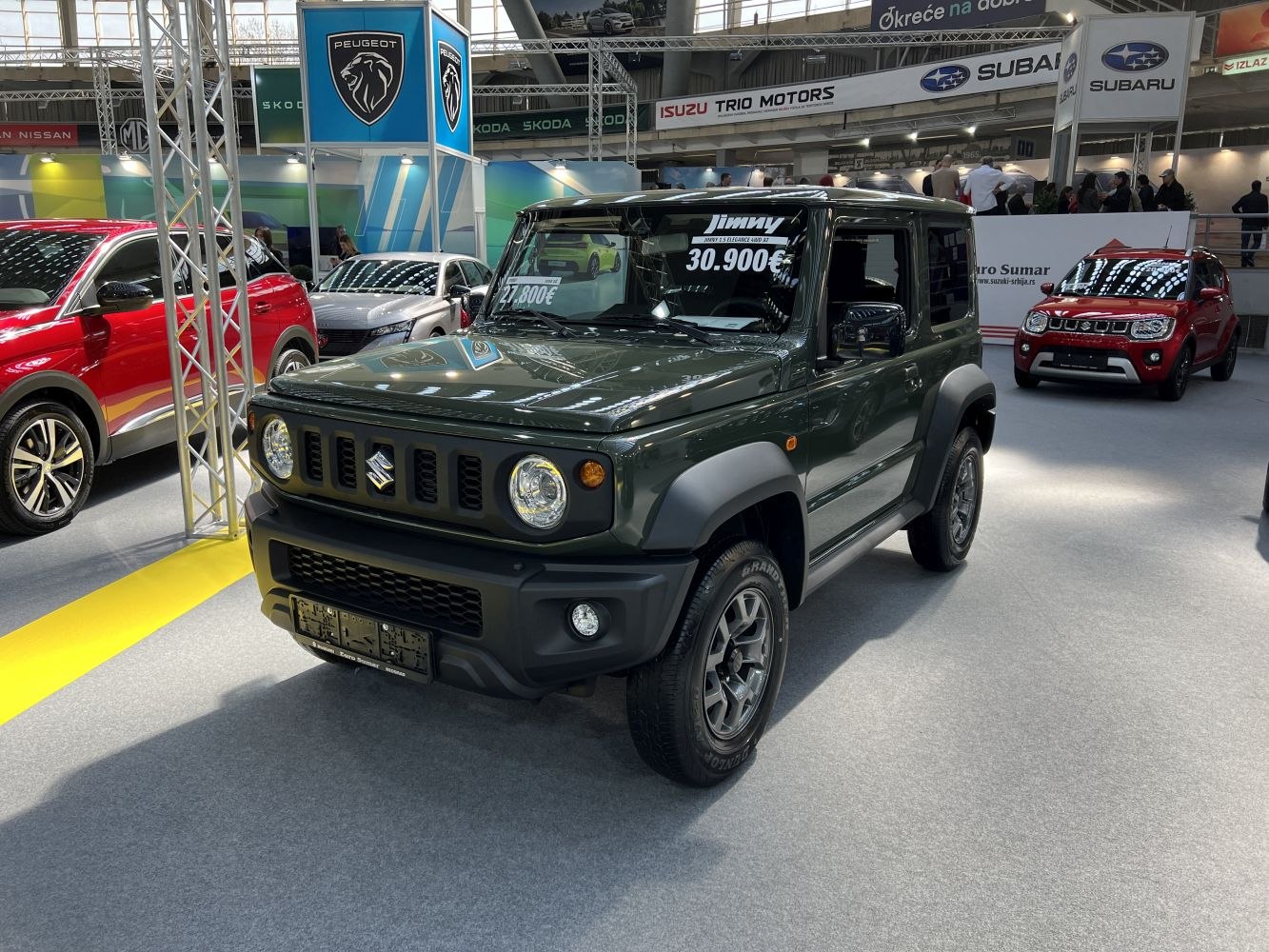 Boxy compact SUV front with round headlights and rugged design