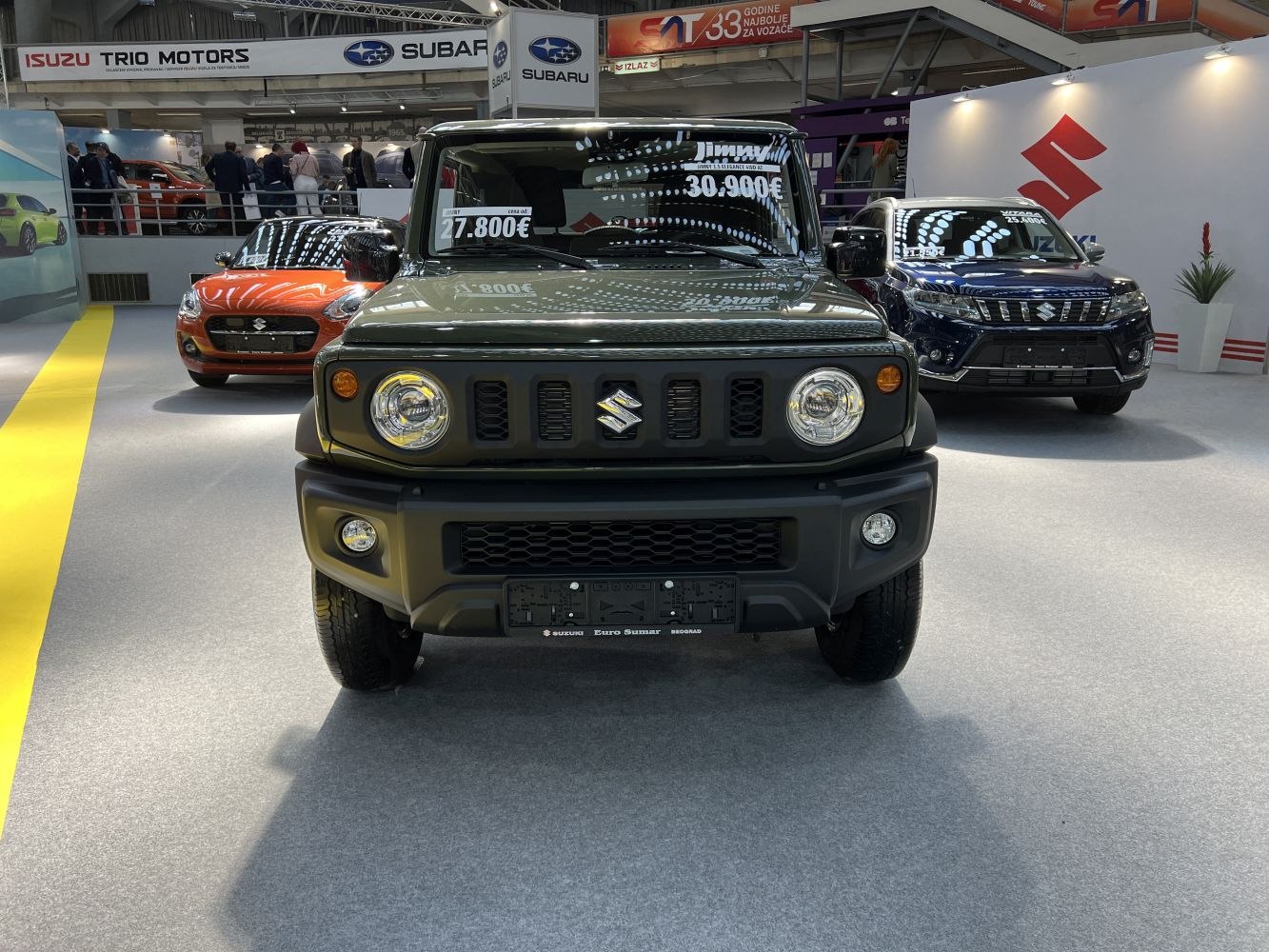 Front view of a boxy off-road SUV with round headlights and black grille