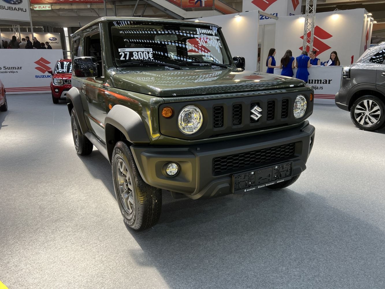 Front view of compact SUV with round headlights and rugged design.