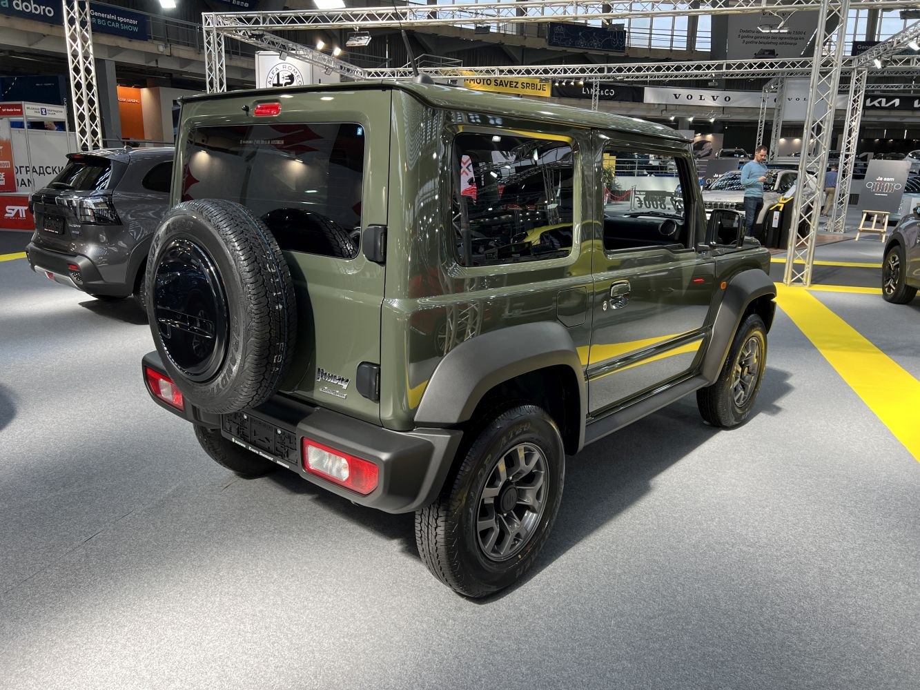 Compact SUV with rear spare tire and rugged boxy body design