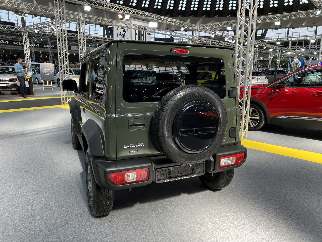 Rear view with spare wheel on tailgate of compact off-road SUV