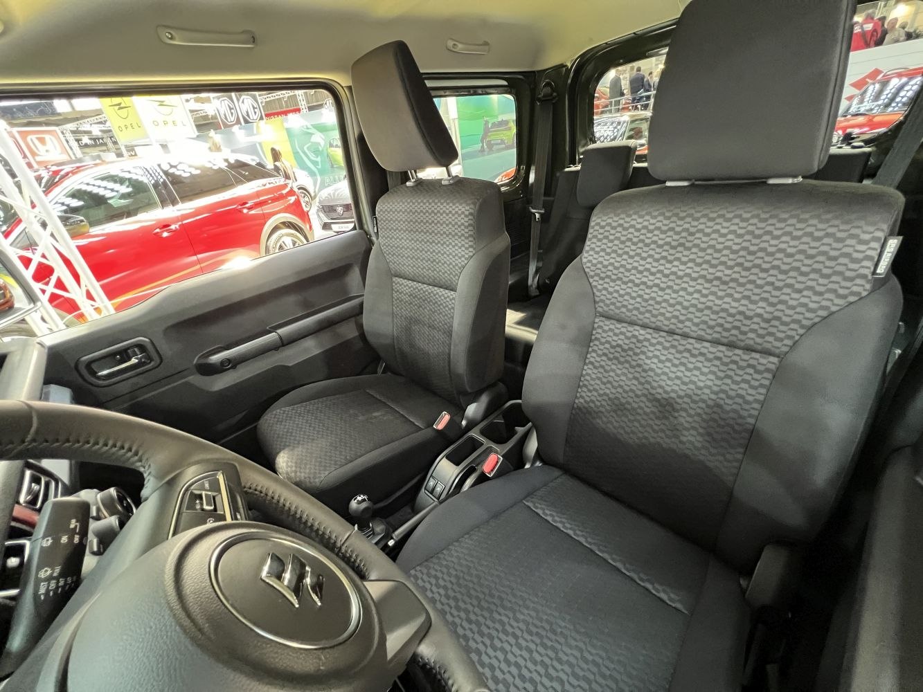 Front seats and steering wheel with door panel in compact SUV