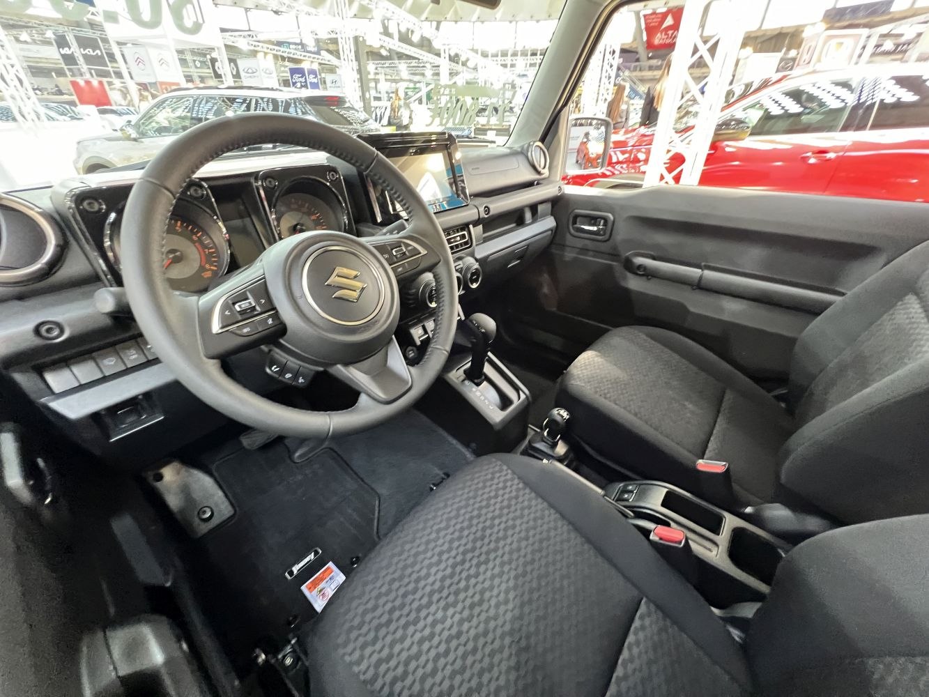 Steering wheel, dashboard, front seats, and center console interior view