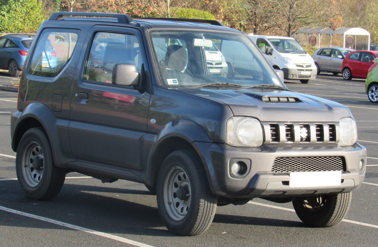 Compact SUV with hood scoop, roof rails, and high ground clearance