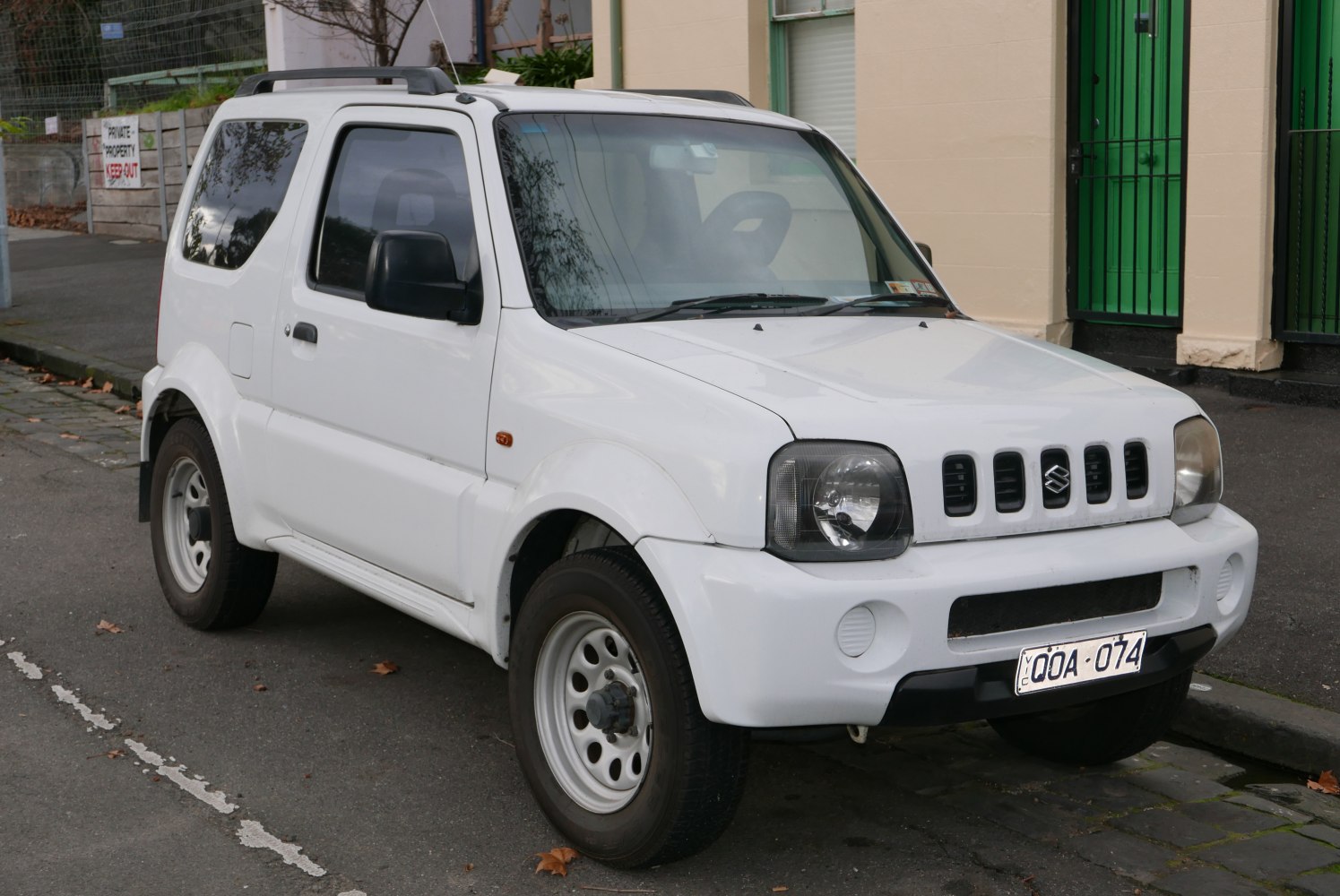 White Suzuki Jimny III front side view compact SUV