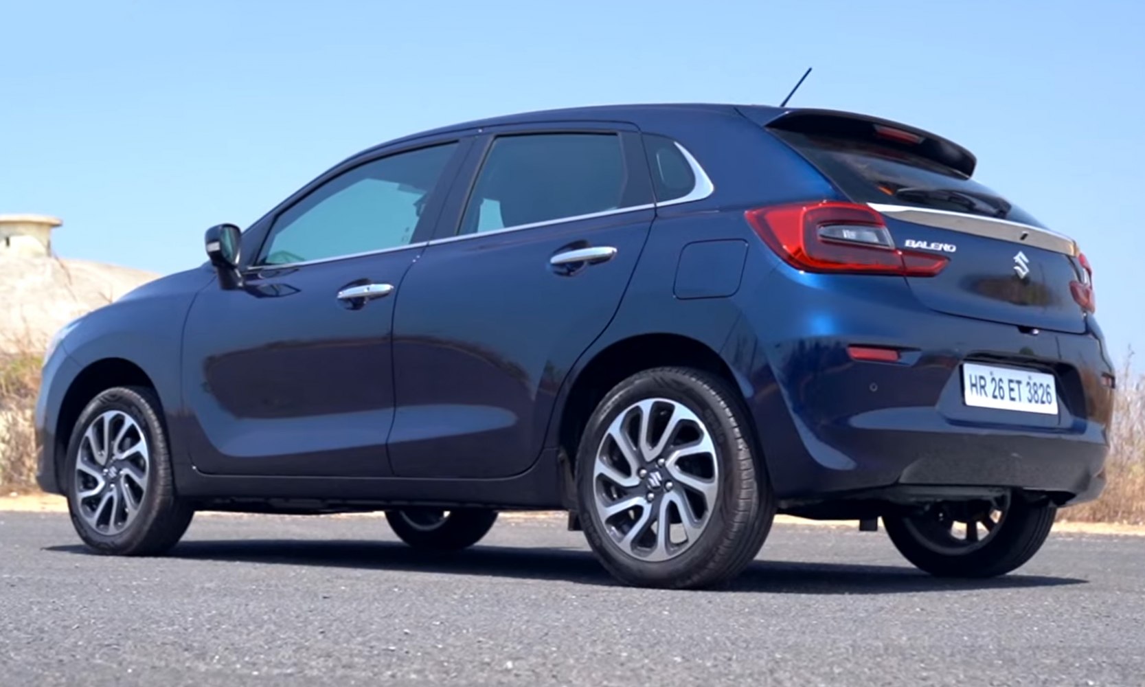 Rear side profile and alloy wheels of a compact hatchback
