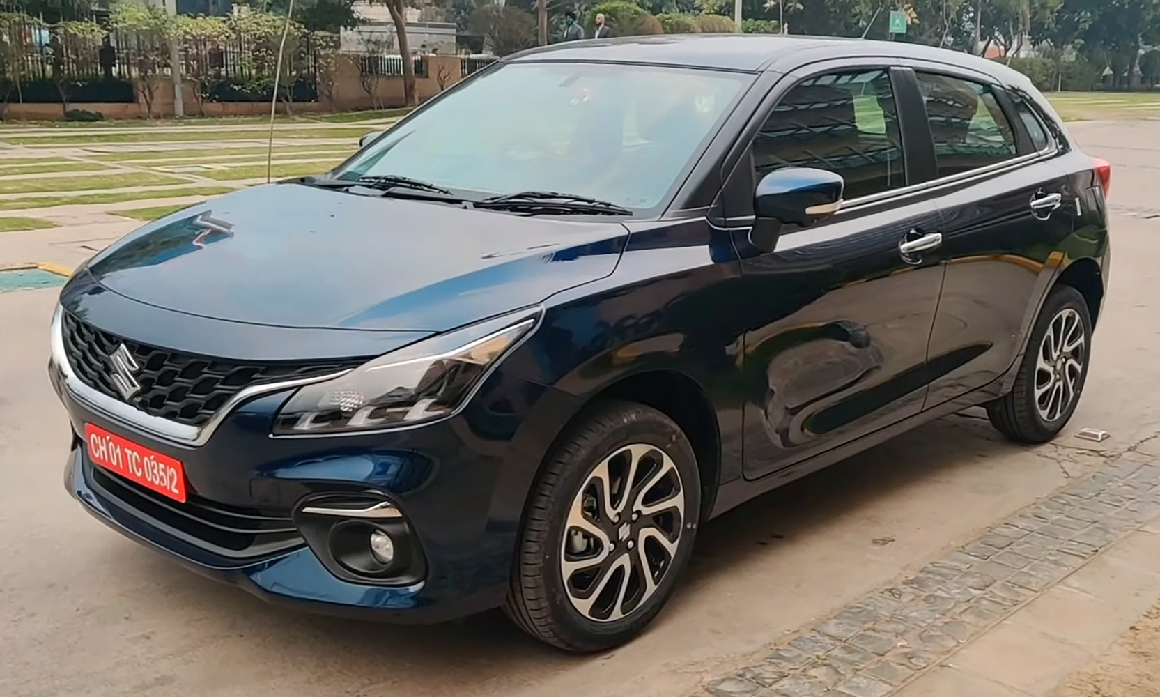 Front-side view of a hatchback with alloy wheels and sleek headlights