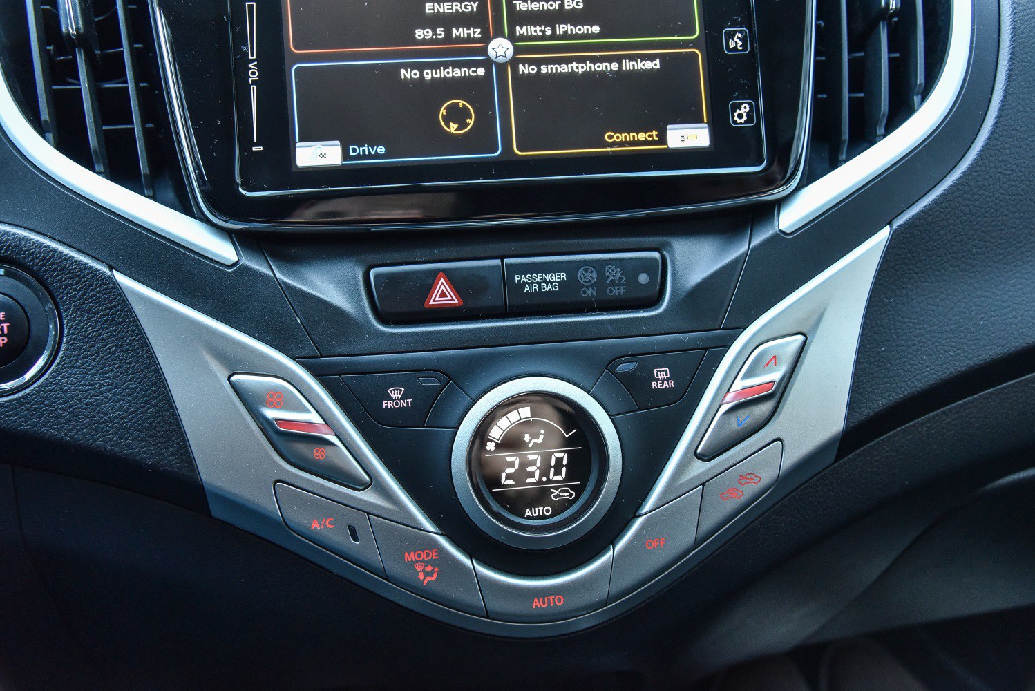 Digital climate control with temperature display and infotainment screen