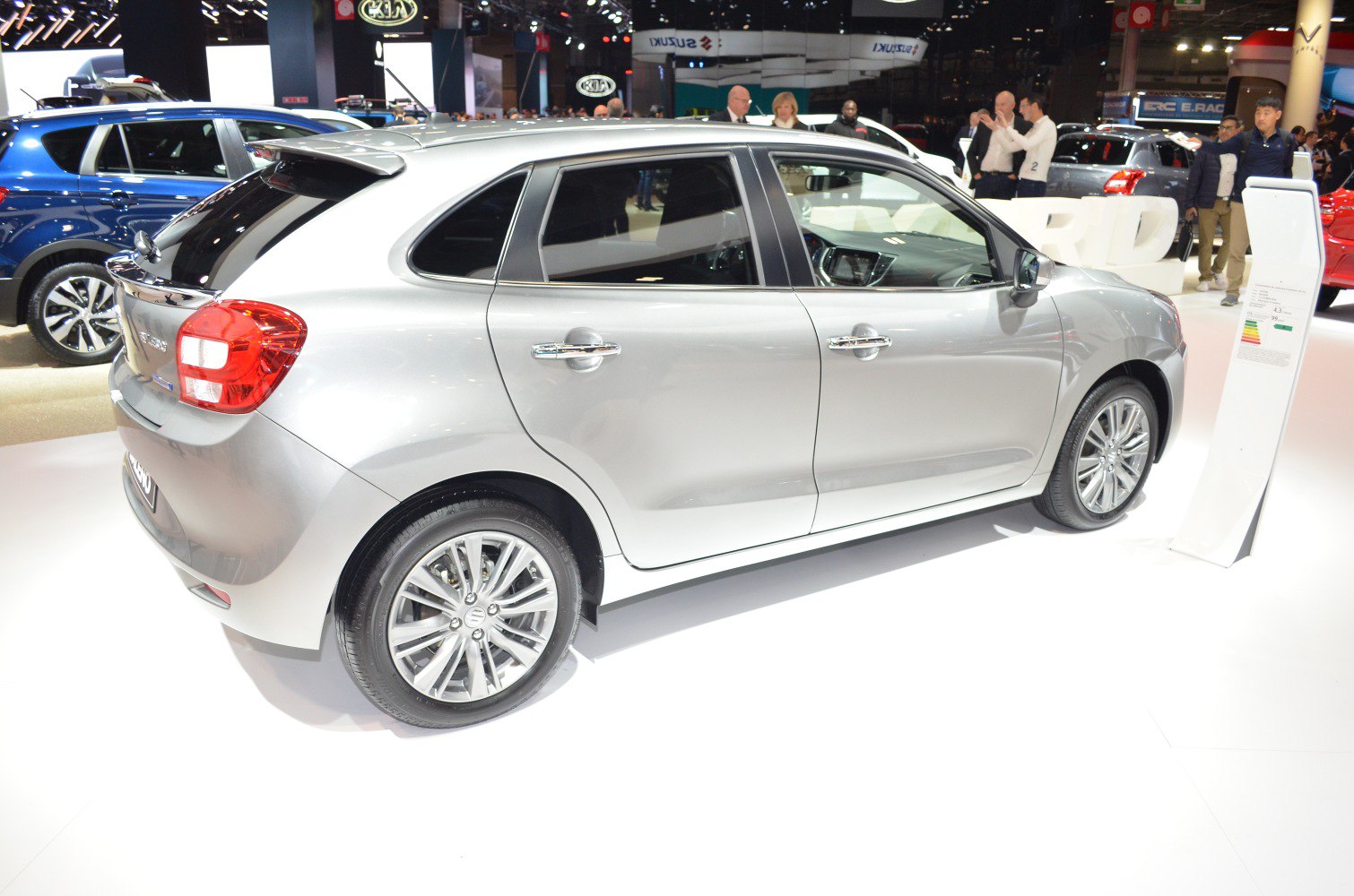 Silver hatchback with alloy wheels and rear spoiler side profile