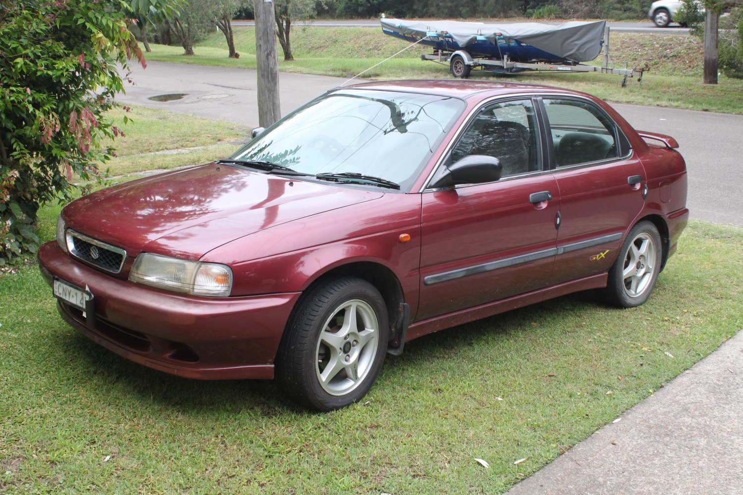 Front side view of a 1995 sedan with alloy wheels
