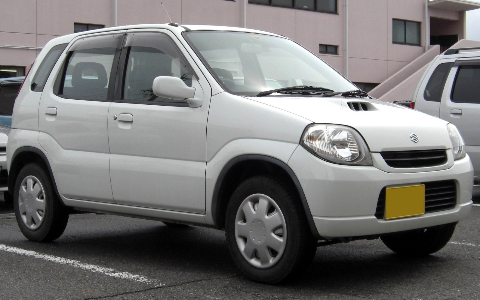 Compact hatchback side profile with four doors and smooth design lines