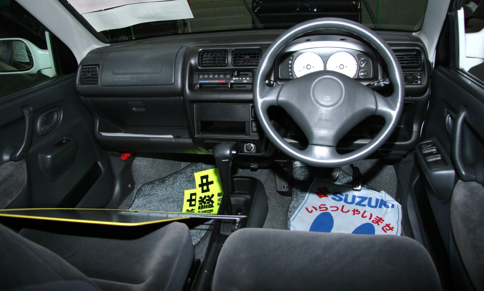 Compact car interior dashboard and steering wheel layout