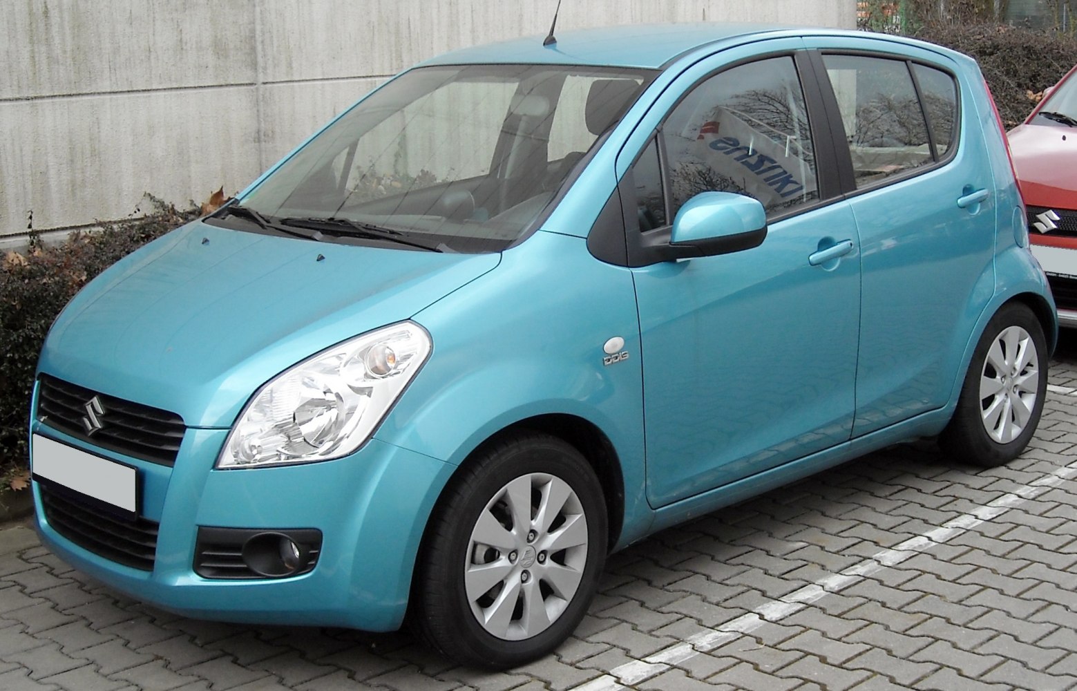 Compact hatchback with distinctive front grille and large headlights