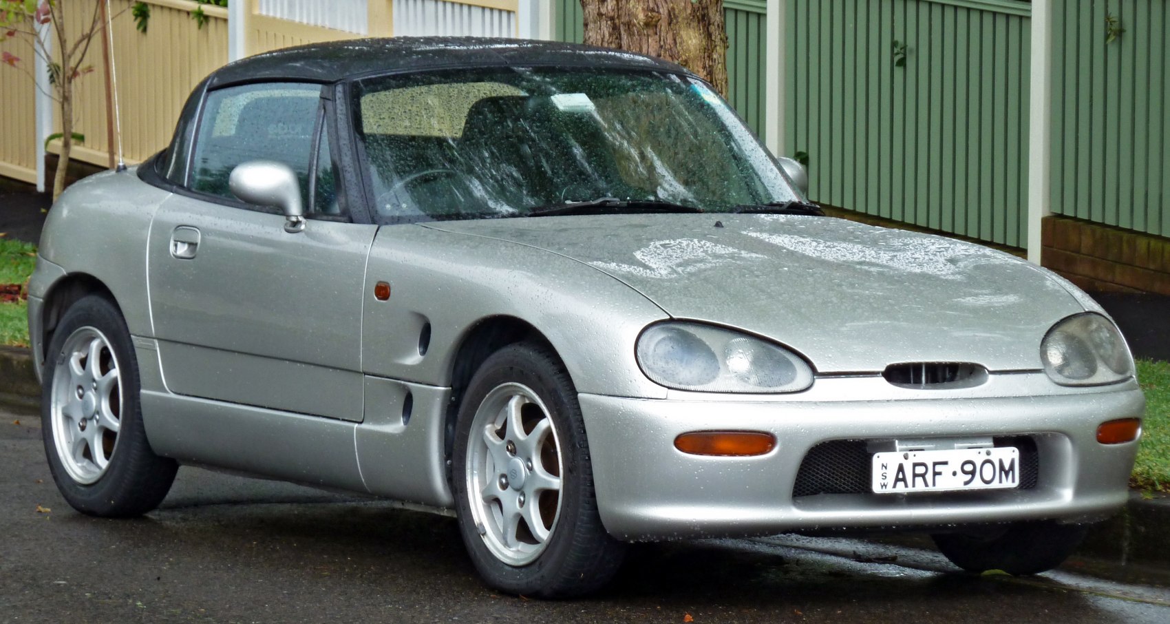 Compact convertible with pop-up headlights and alloy wheels