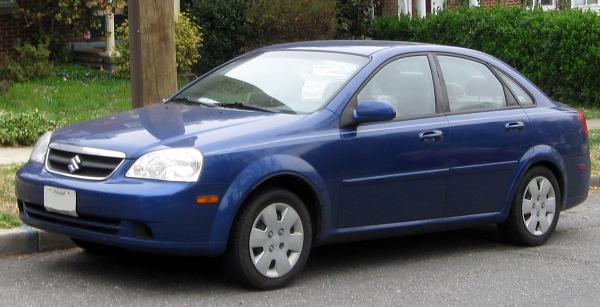 Compact sedan with classic rounded headlights and four doors