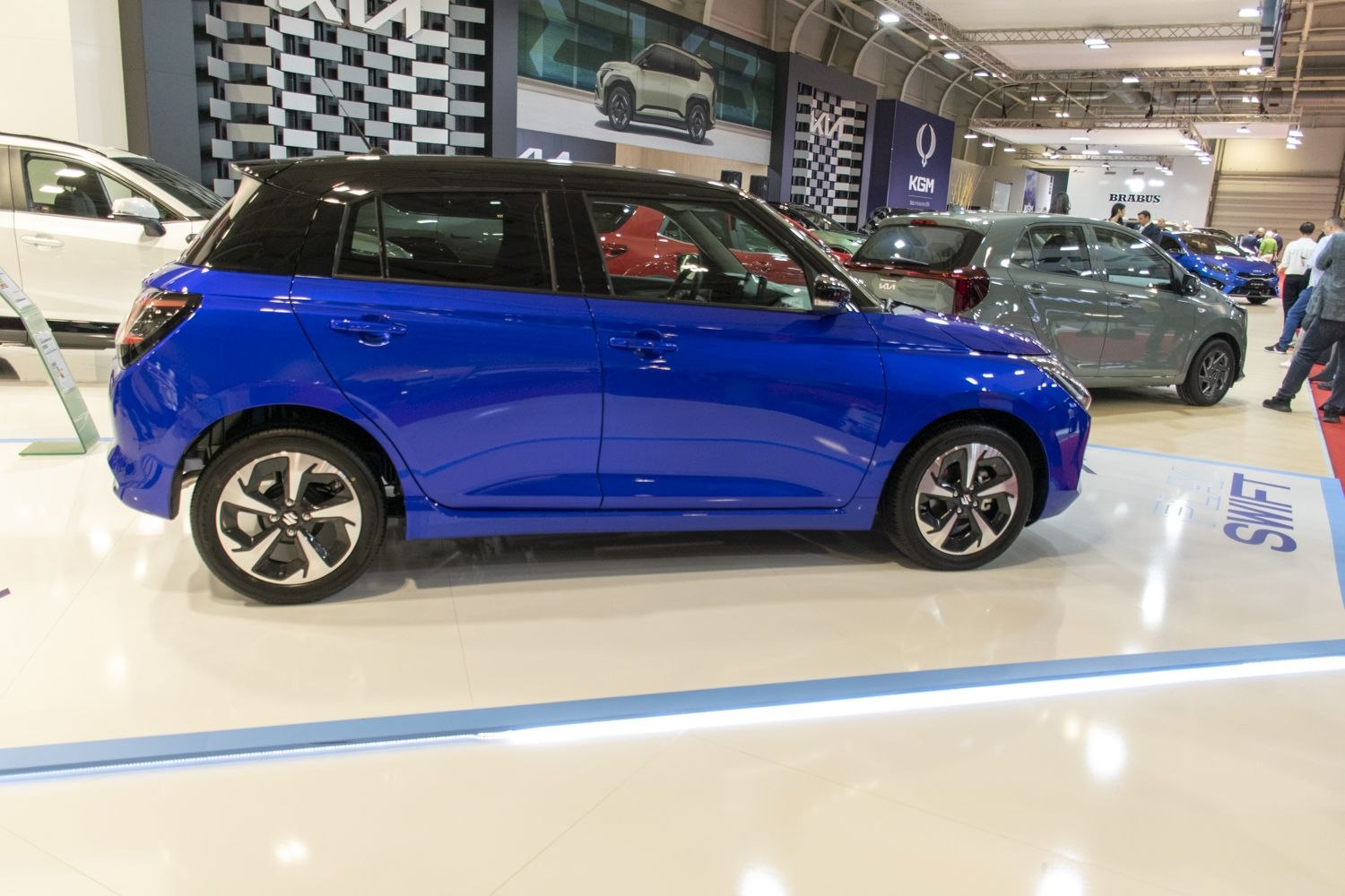 Blue and black two-tone hatchback with modern alloy wheels