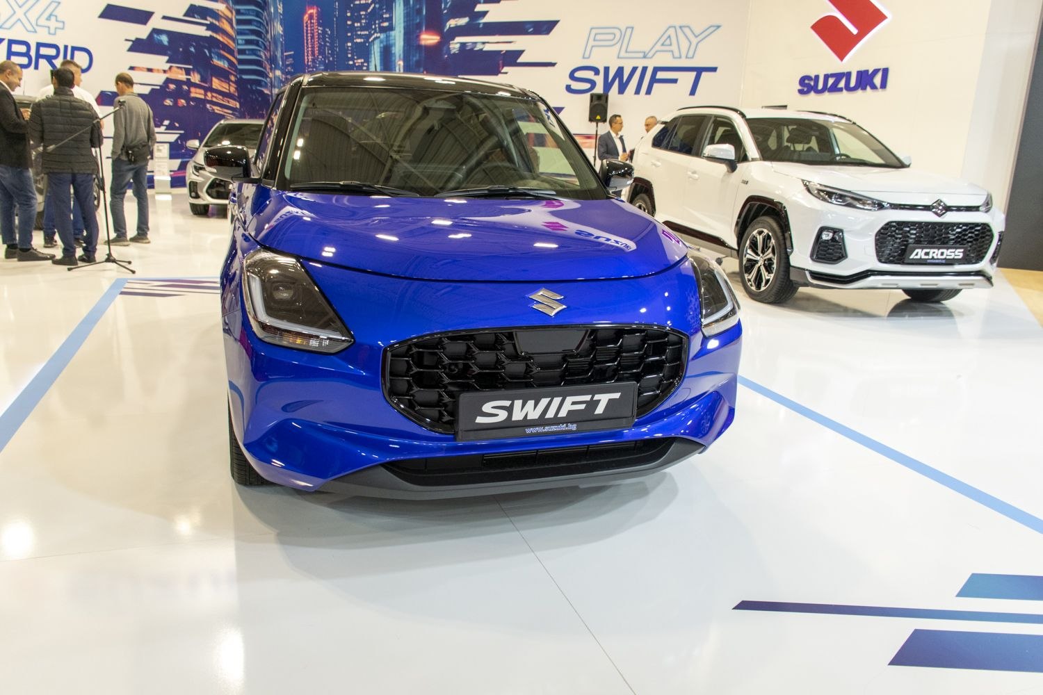 Front view with sleek headlights and honeycomb grille design