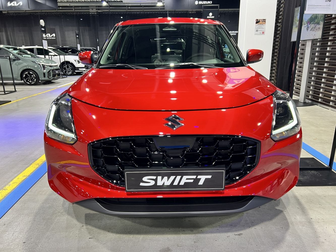 Front view with LED headlights and large grille in red