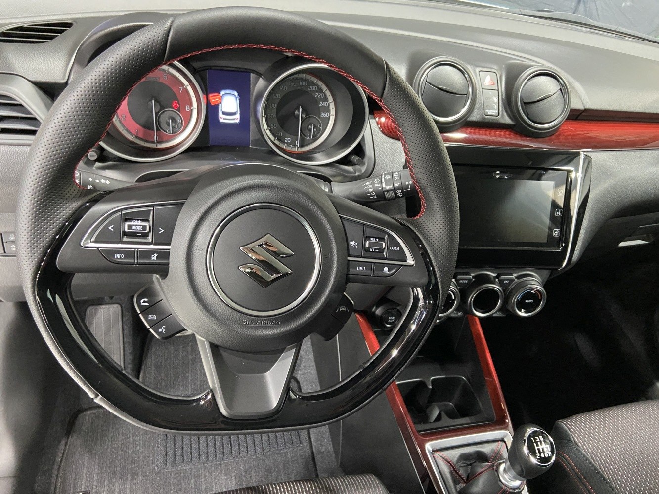 Steering wheel, dashboard, manual gearbox, and climate control knobs