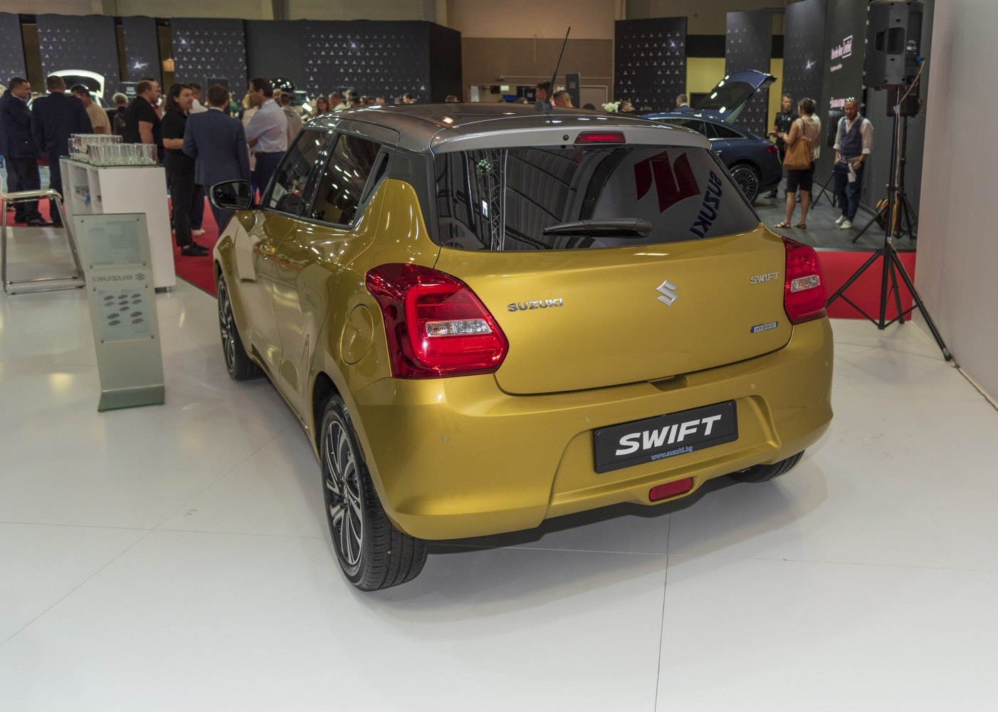 Rear view of modern compact hatchback with hybrid badge and distinctive taillights