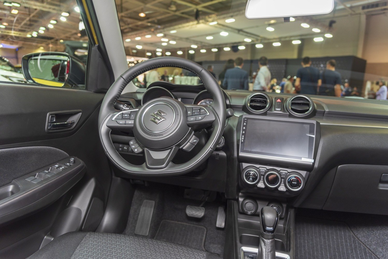 Modern steering wheel and dashboard with infotainment and climate controls