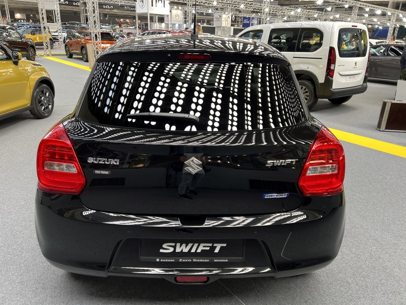 Rear view of hatchback with taillights and badges
