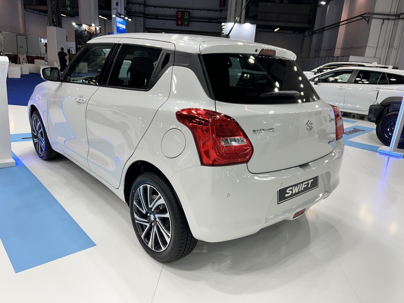 Rear-side view showing tail lights and alloy wheels of a compact hatchback