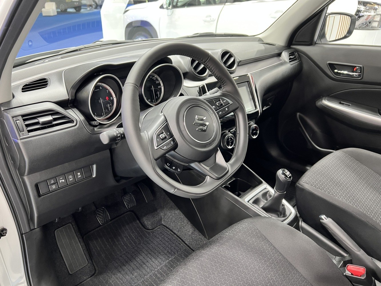 Manual transmission cockpit with multifunction steering wheel and modern dashboard