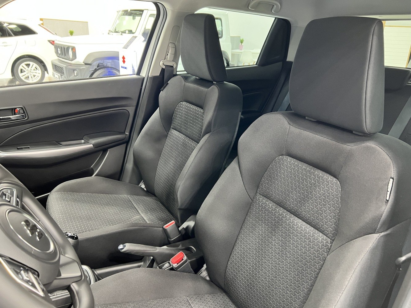 Front fabric seats with patterned upholstery in vehicle interior