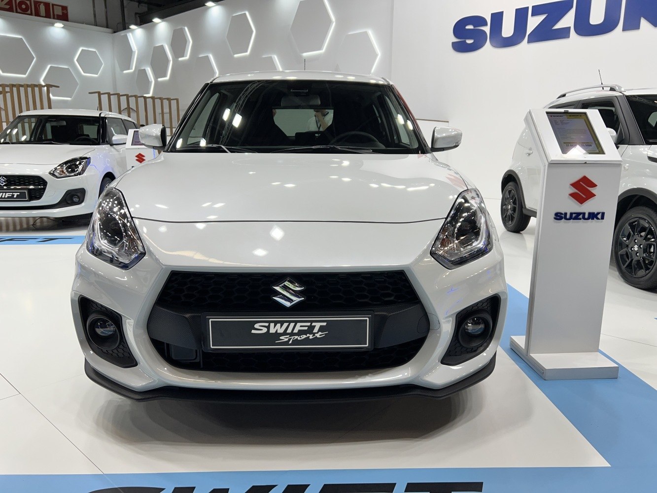 Front view with sporty grille, headlights, and fog lights