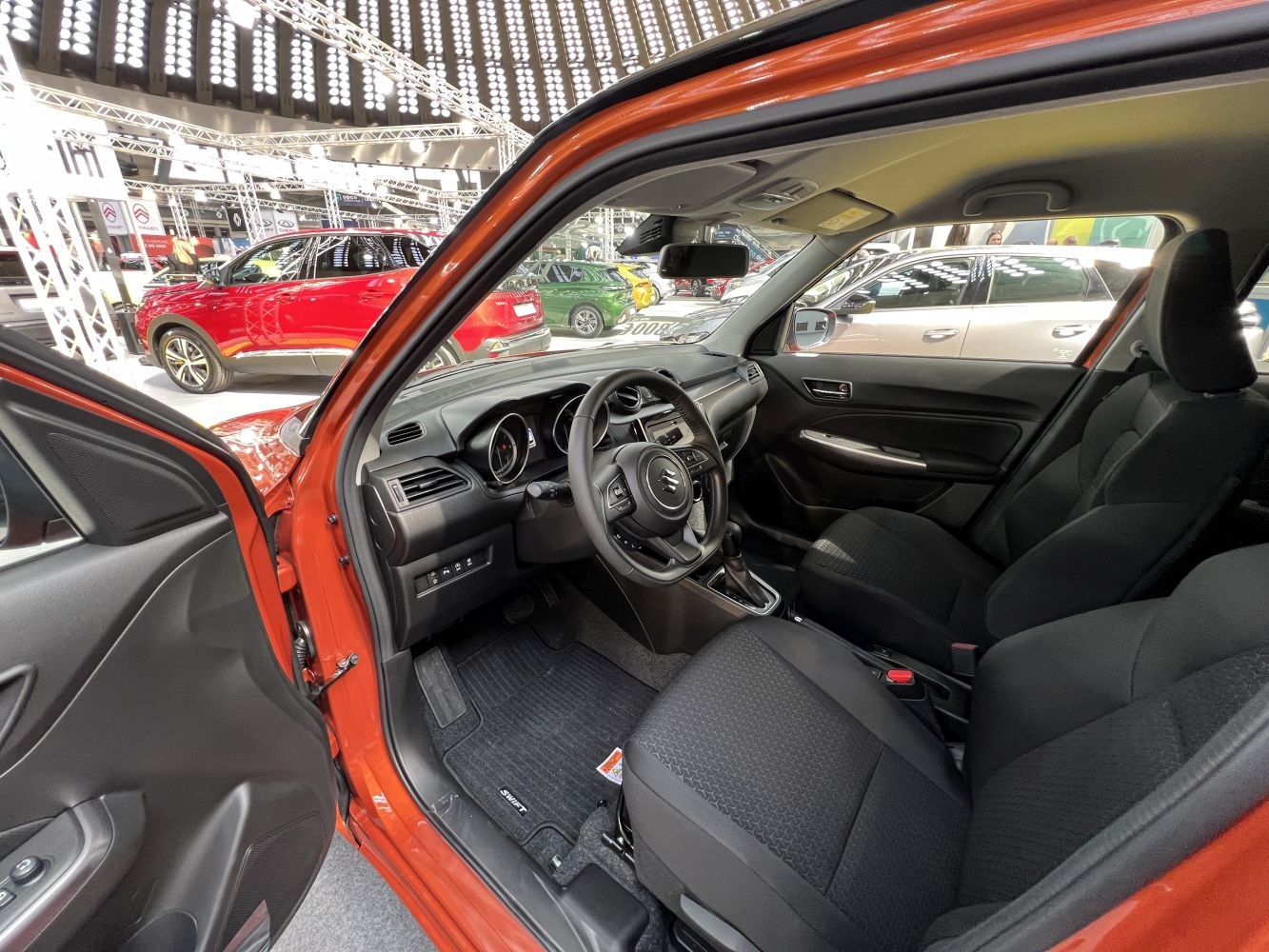 Compact car interior with dashboard and steering wheel view