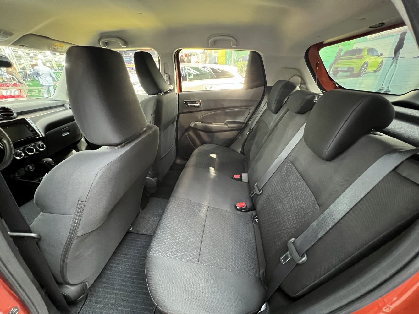 Rear seating and fabric interior with seat belts and headrests