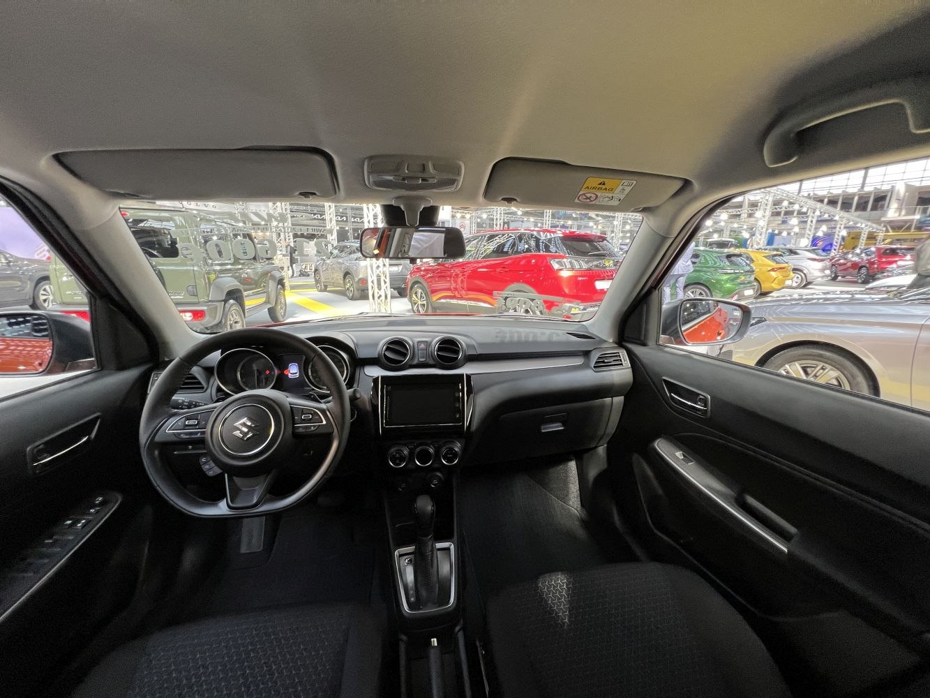 Dashboard, steering wheel, and center console interior view