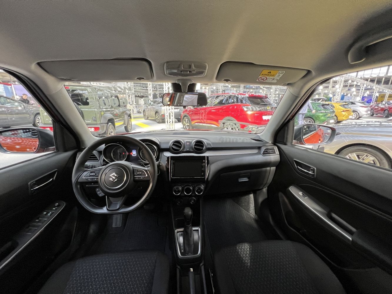 Modern dashboard and steering wheel with center console and air vents