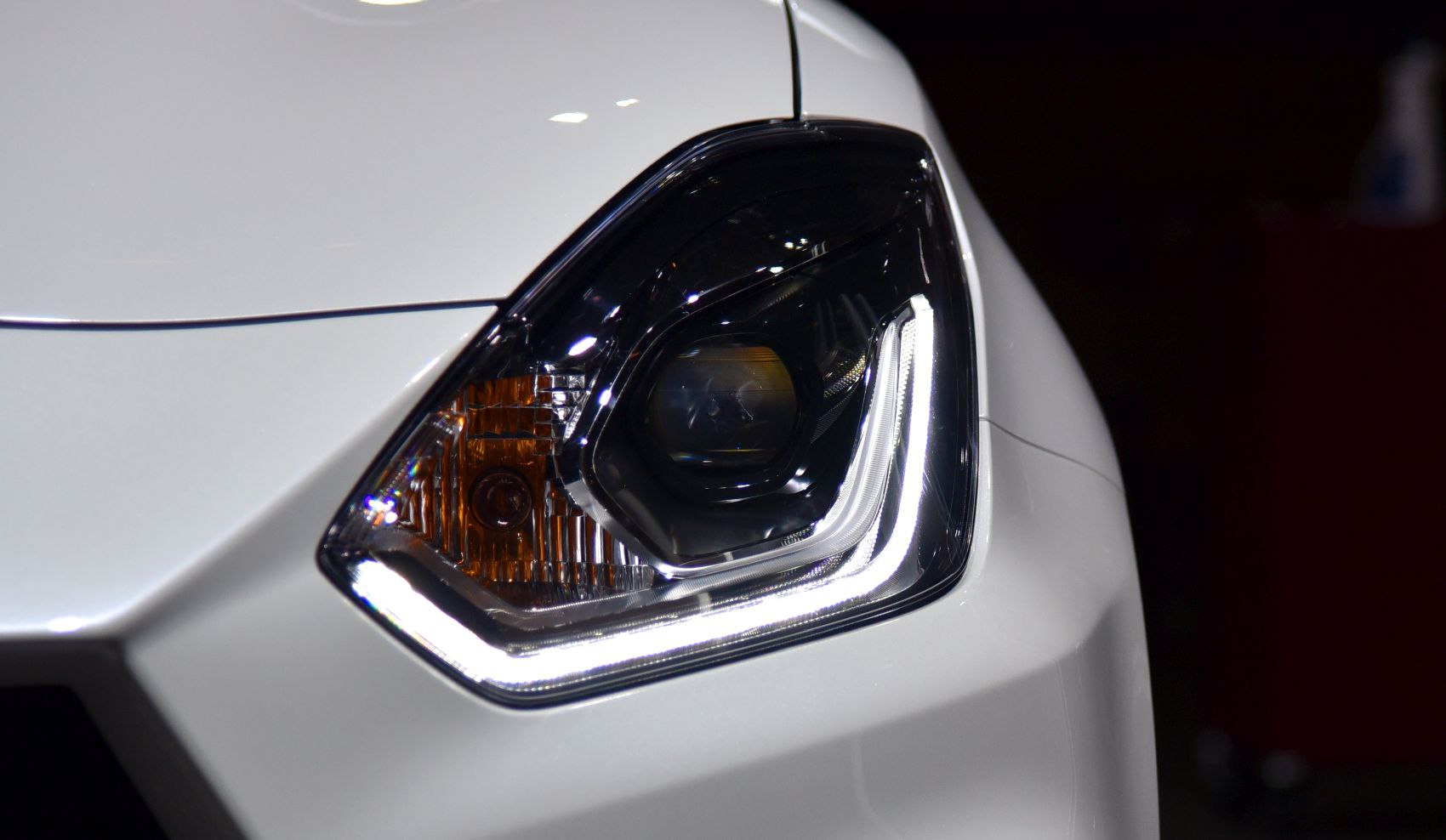 Close-up of a modern car headlight with LED daytime running lights