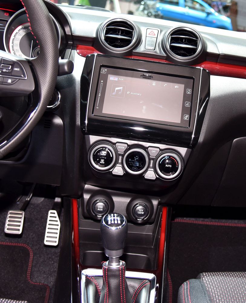 Manual gearbox and touchscreen infotainment system in car interior