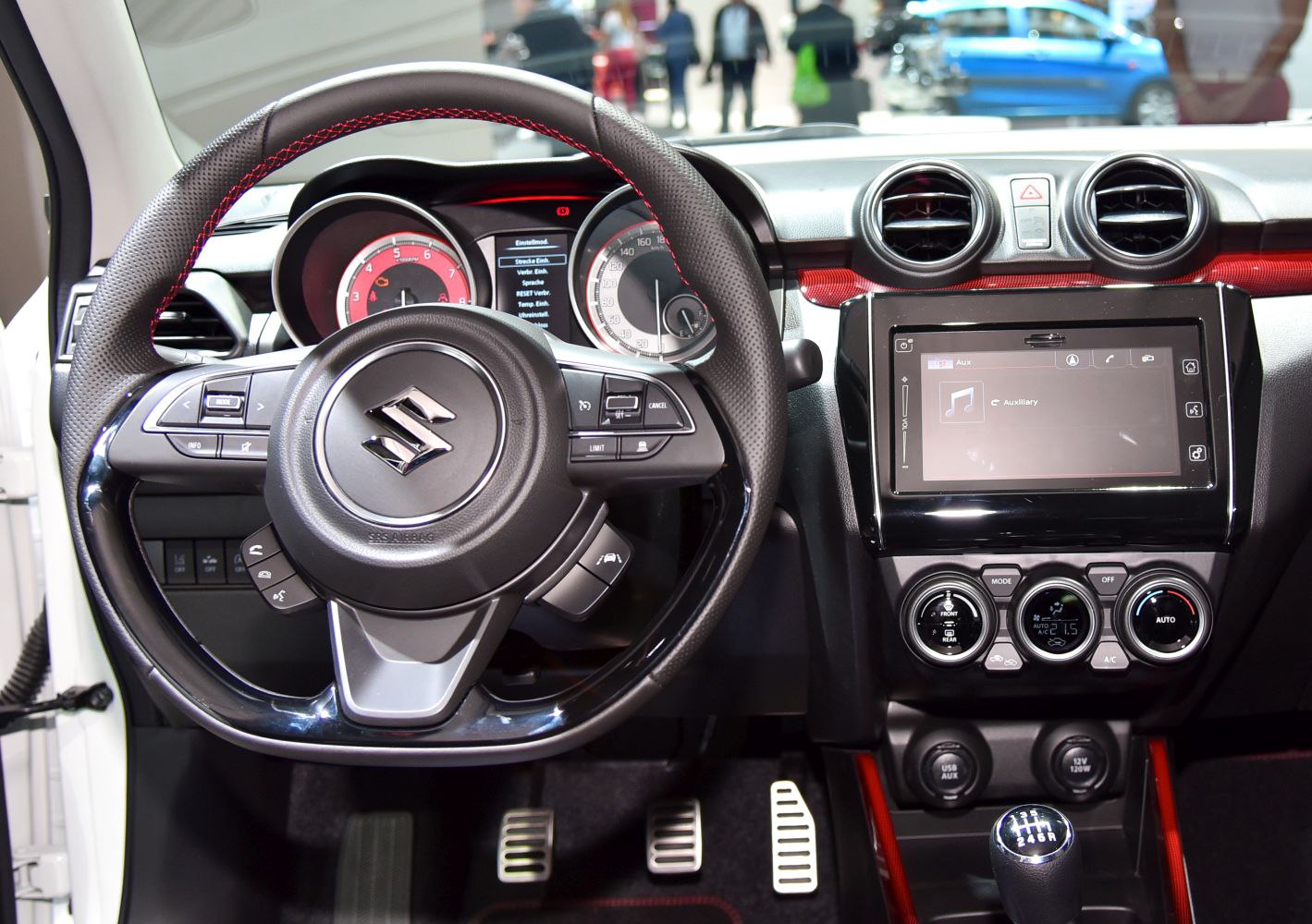 Steering wheel, instrument cluster, multimedia screen, and climate controls interior view