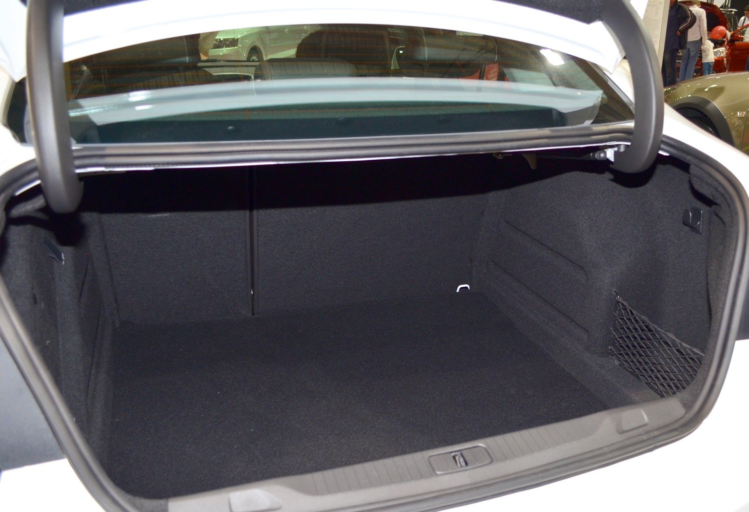 Spacious black trunk interior with side storage net